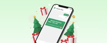 Smartphone displaying a WhatsApp message with a special Christmas offer surrounded by gift boxes and Christmas trees, symbolizing automated festive marketing and customer engagement.